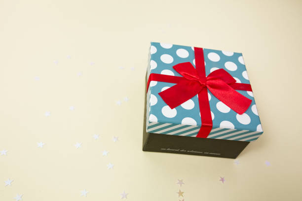 Gift box decorated with bright red knotted bow