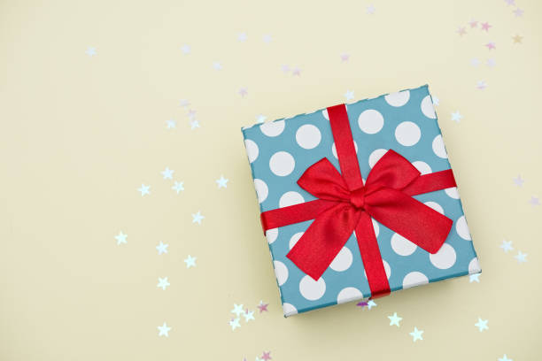istock Gift box decorated with bright red knotted bow 2155055040