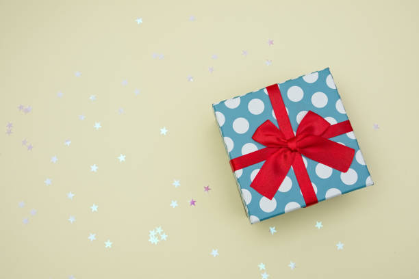 istock Gift box decorated with bright red knotted bow 2155055042