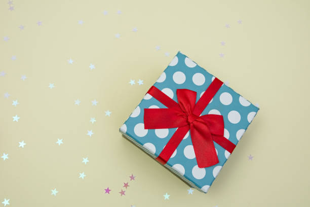 istock Gift box decorated with bright red knotted bow 2155055048