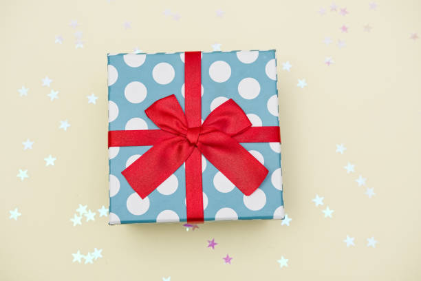 istock Gift box decorated with bright red knotted bow 2155055055