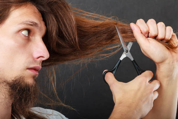istock Barber cutting hair 2155056169