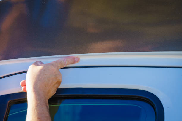 istock Applying silicon on caravan body 2155056225