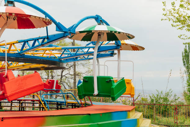 istock swing carousel attractions in the amusement park 2155057576