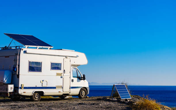istock Caravan with tilt solar panels on roof. 2155057815