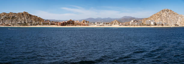 Panoramic image composed of nine images shot from a cruise ship in the Pacific Ocean departing Cabo San Lucas. Hotels seen are the most upscale in Cabo.
