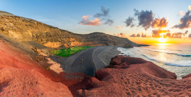 El Golfo with unique Lago Verde and black sands beach. Lanzarote, Canary islands El Golfo, Lanzarote: A stunning green lagoon located in a volcanic crater. mirador stock pictures, royalty-free photos & images