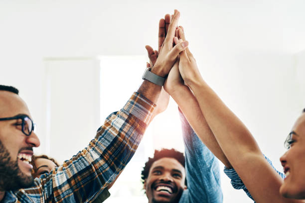istock High five, support and meeting for team building in office, motivation and creative partnership. Business, employees and celebrate for work, mission or collaboration success at startup design company 2155061207
