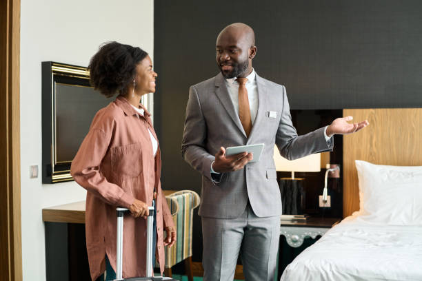 istock Hotel Manager Welcoming Guest 2155061901