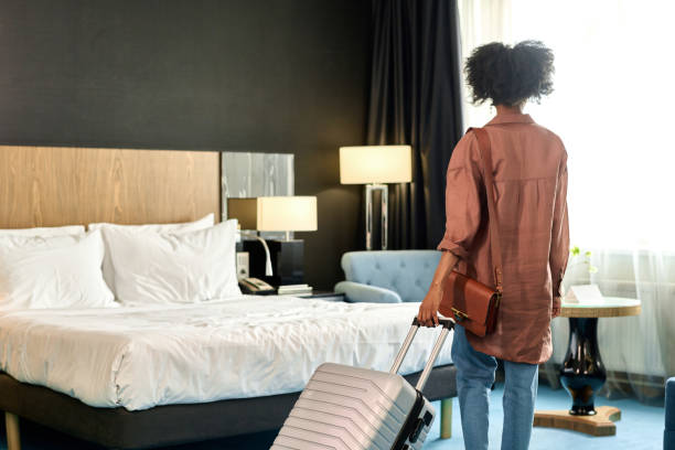 istock Back View at Guest Entering Hotel Room 2155061956