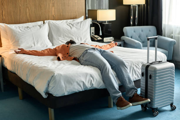 istock Excited Black Man Falling in Bed 2155061965