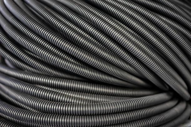 istock Full surface texture of black plastic tubes. Dark tubes background. 2155063080