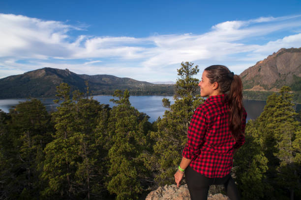 istock Woman on Top of a Mountain 2155063236