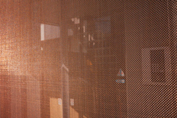 istock Texture of a close-meshed copper lattice shot from the side. 2155063532