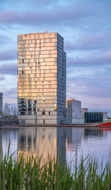 istock the tower apartment building with reflection in Almere at sunset 2155064801