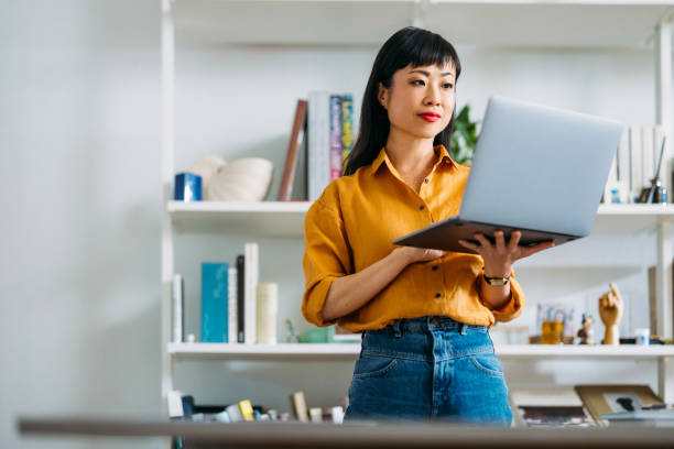 Woman Working on Laptop in Modern Home Office