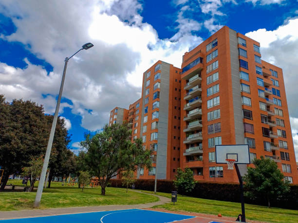 Residential buildings with blue sky with a basketball court in front