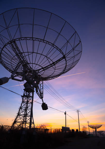istock low angle of abandoned telescopes with colorful sunset sky, universe science, explore outer space 2155065327