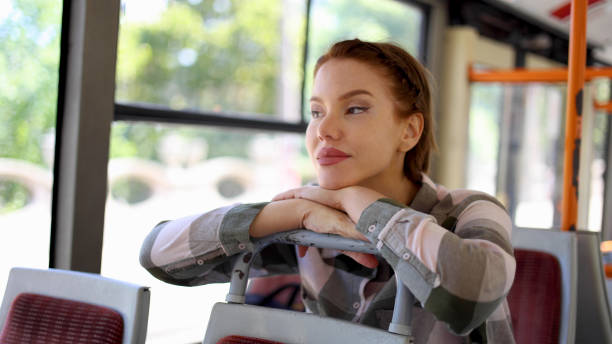 istock Beautiful woman enjoying a bus ride 2155065634