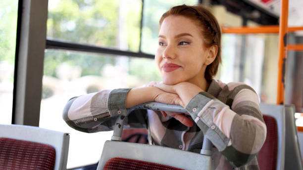 istock Beautiful woman enjoying a bus ride 2155066140