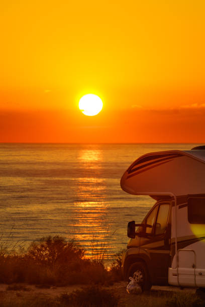 istock Caravan on sea at sunrise. 2155066447