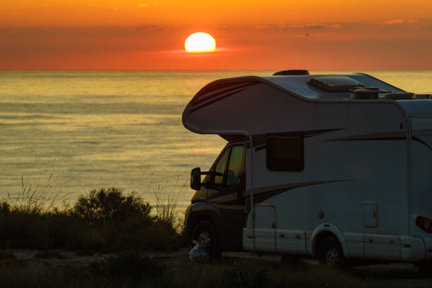 istock Caravan on sea at sunrise. 2155066539