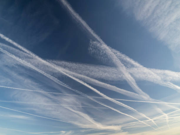 istock Blue sky with airplane contrails 2155071059