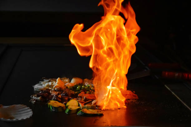 istock chef's hands with spatula over teppanyaki. Teppan show 2155071312