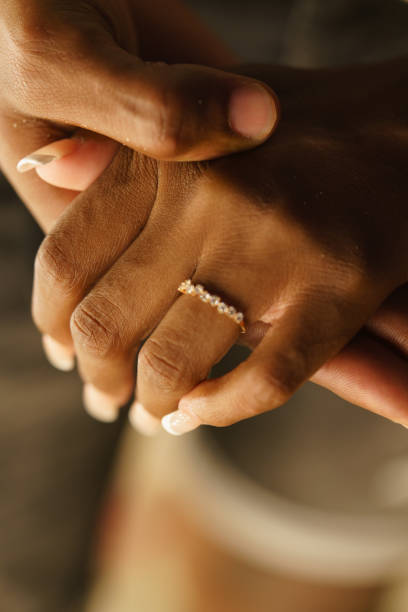 istock a couple of black hands showing wedding ring 2155072816