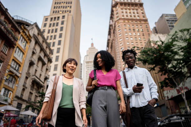 istock Coworkers talking and walking on the city 2155074871