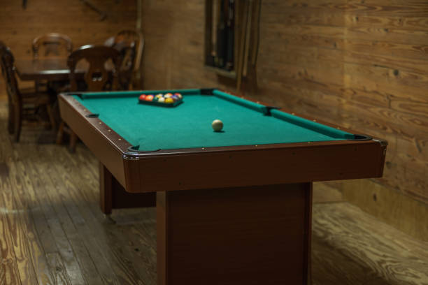 istock A pool table in a rustic cabin that is all set up and ready to play 2155075076