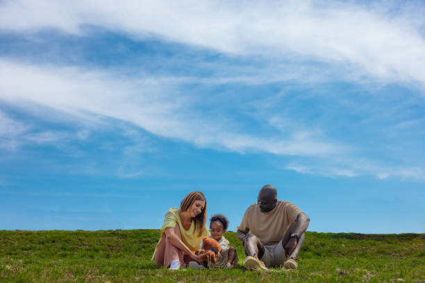istock Family picnic on a grassy hill 2155075886