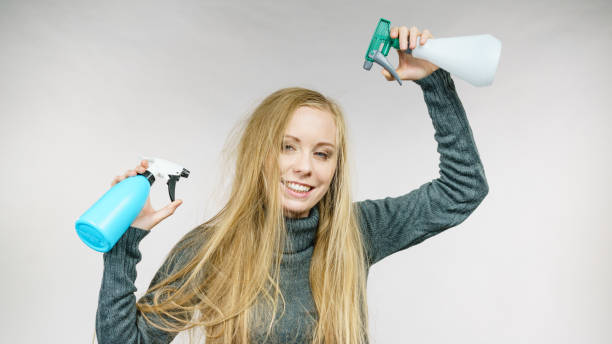 istock Female messy long hair holds spray bottle 2155077602