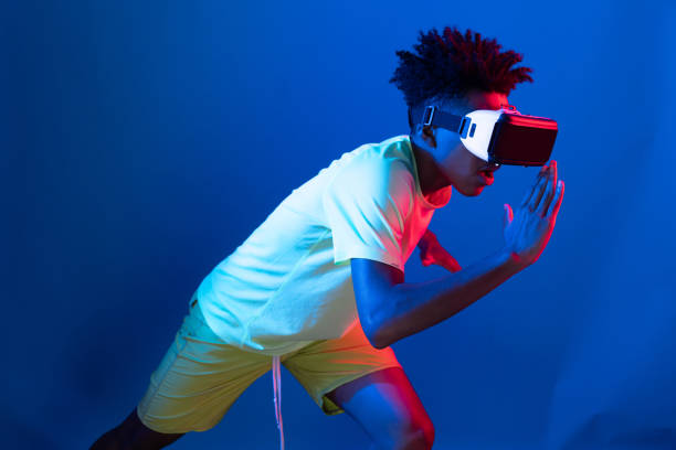 istock African runner wearing VR running exercise running neon wall. Contrivance. 2155079751
