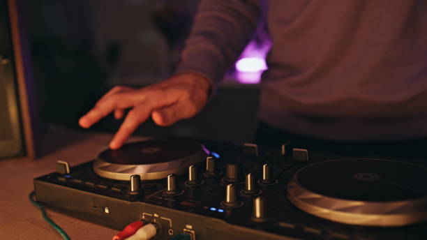 istock Skilled dj creating electronic music at night party close up. Guy creating beat 2155079990