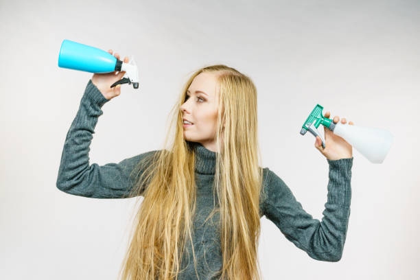 istock Female messy long hair holds spray bottle 2155080249