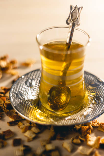istock apple black tea on traditional glass turkish cup with plate and spoon 2155080548