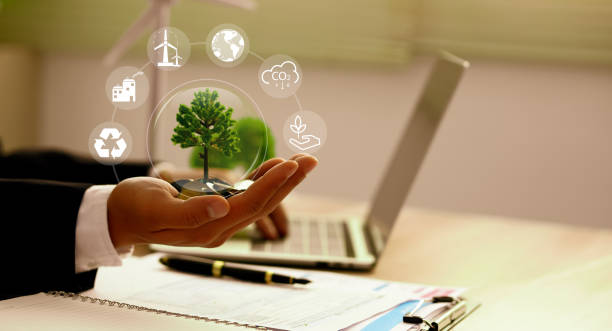 istock NET ZERO Environment. Green earth ball in hand in green forest background. Ecosystem. Earth Day. Forest conservation CSR ESG. 2155081524