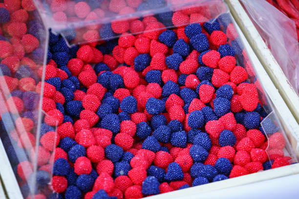 Close up of shop box with many colorful jelly sweets, fruit gummi candies. Sugar food.