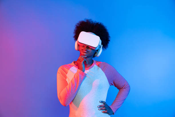 istock Profile thinking beautiful African wearing VR glasses metaverse. Contrivance. 2155082331