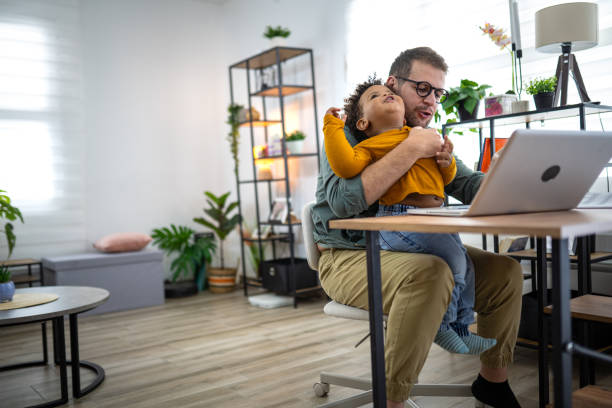 istock Using a laptop with my toddler in my lap 2155082904