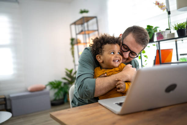 istock Using a laptop with my toddler in my lap 2155083716