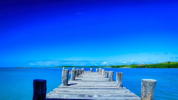 istock Wooden Dock on Caribbean Tropical Island 2155083733