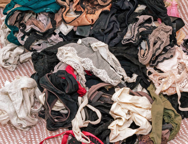 istock Pile of clothes at home interior 2155084237