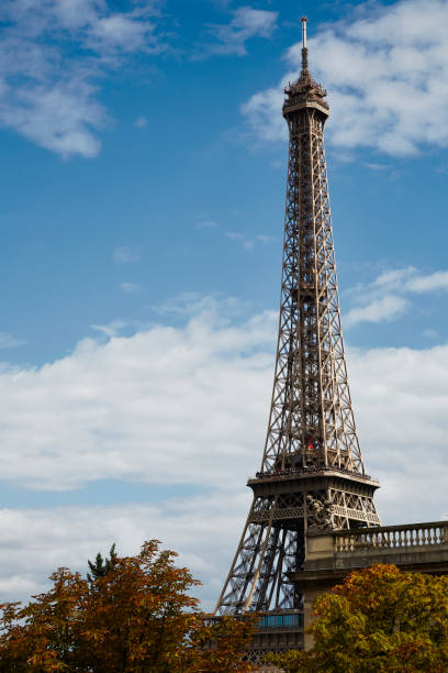 Paris, France -- August 19, 2014: Eiffel Tower is a wrought-iron lattice tower on the Champs de Mars, Paris France. It is named after Gustave Eiffel, who designed and built the tower between 1887 and 1887. It is located in the 7th arrondissement of Paris, and is nicknamed the Iron Lady. The Eiffel Tower is the most visited monument in the world.