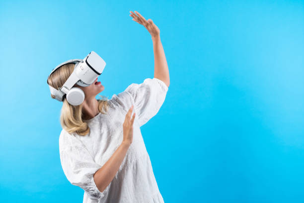istock Smart girl excited with metaverse by using VR goggle at background. Contraption. 2155084591