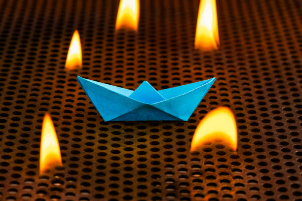 istock Fire flames with blue paper boat - Art for decoration 2155085387