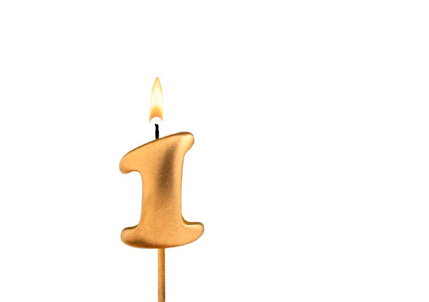 istock Birthday number 1 - Golden candle on white background 2155085428