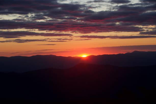 Overlooking a mountain range at sunrise.