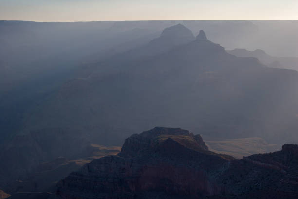 istock Sun rays at sunrise in Grand Canyon national Park. 2155092063
